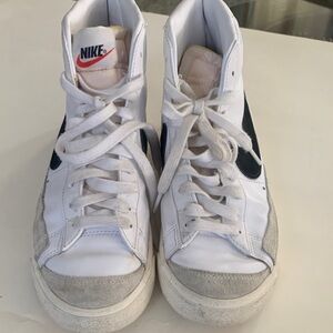 Nike White High-Top Sneakers with Black Swoosh